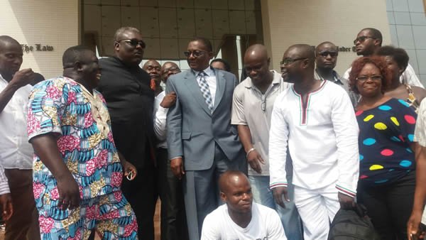 Nii Armah Ashitey and friends smile to their temporary victory in court