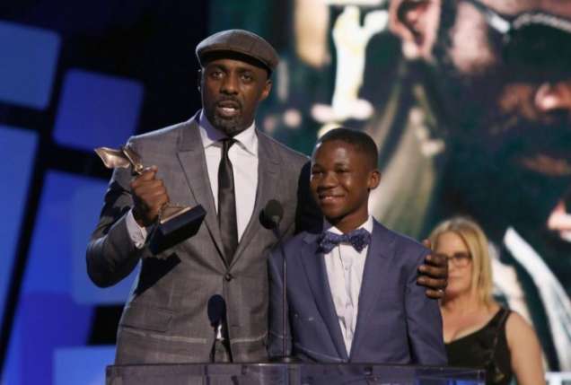 Abraham Attah and Idris Elba on stage in the US