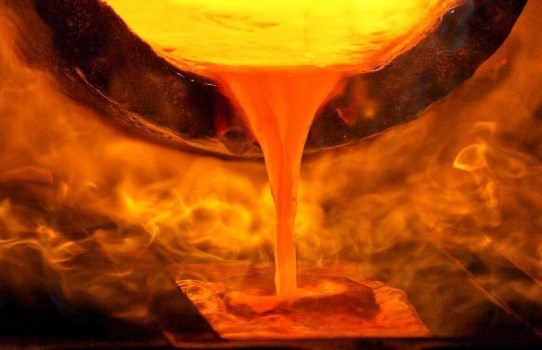 Melted gold flows out of a smelter into a mould of a bar at a plant of gold refiner and bar manufacturer Argor-Heraeus SA in the southern Swiss town of Mendrisio, March 1, 2012. REUTERS/Pascal Lauener