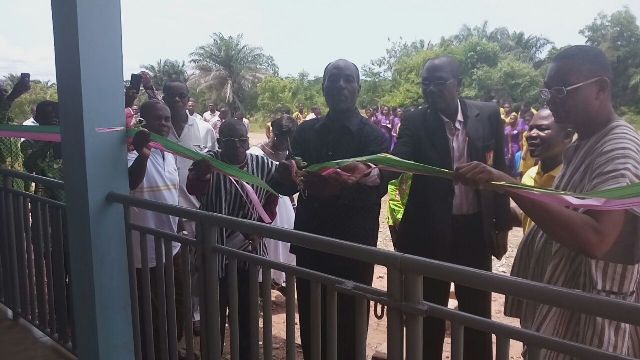 The PTA Chairman, Mr. Agat 9in suit) assisted by the headmaster, Mr. Tugah officially commission the new staff bungalows