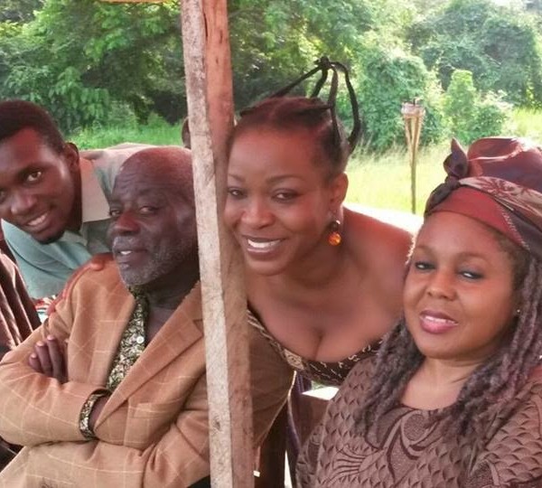 Former Ghana Actors Guild President, Fred Amugi with other actresses