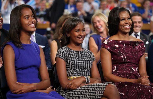 Malia Obama, Sasha Obama, and First lady Michelle Obama listen as Democratic presidential candidate, U.S. President Barack Obama speaks on stage during the final day of the Democratic National Convention at Time Warner Cable Arena on September 6, 2012 in Charlotte, North Carolina. The DNC, which concludes today, nominated U.S. President Barack Obama as the Democratic presidential candidate. (Photo by Chip Somodevilla/Getty Images)