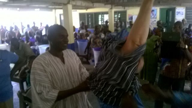 DCE Ahortu assisting the Derbi frock to wear the dress presented