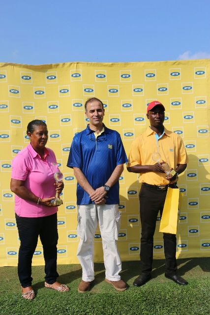 Winners: Men group A winner, Peter Amenyo and ladies group A champ, MOna Captan pose for the album with MTN marketing chief, Asher Khan