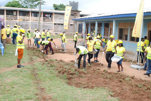 MTN staff volunteers preparing the site for refurbishment