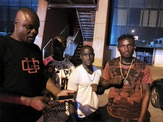Abraham Osei Bonsu (in white) and his manager, Teddy Moore (far left) and friends