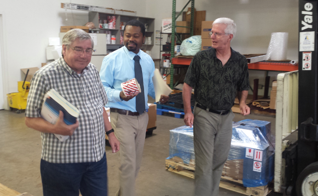 Charles Manu (middle) doing well with Chardel Logistics