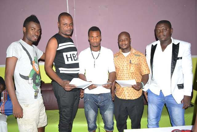 George-Ashie (middle) with Teddy Moore (in black vest) and other Reinsport Management staff and witnesses at the signing-on ceremony back in January 2015