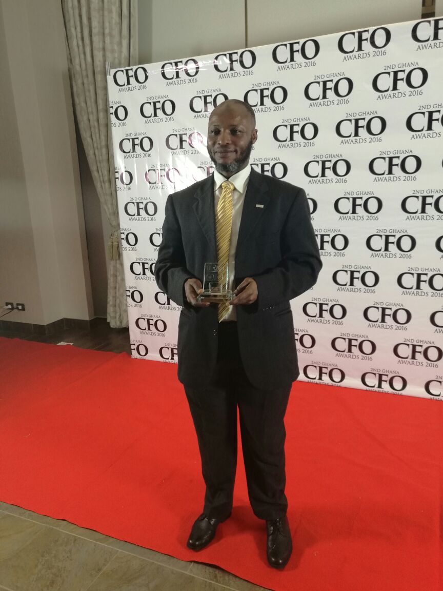 Modupke Kadiri, MTN CFO displaying the award