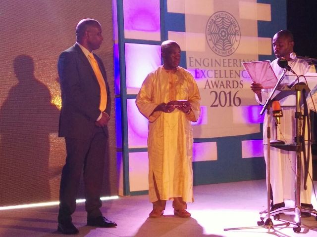 Mr. Rufai receiving the plaque during the awards ceremony