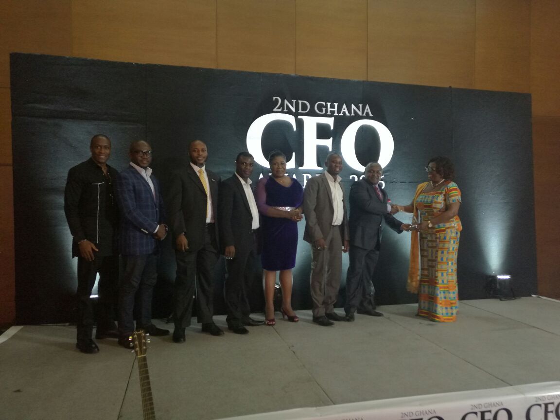 Mr Kobina Enchi, Snr Finanacial Service receiving the award for the Finance team