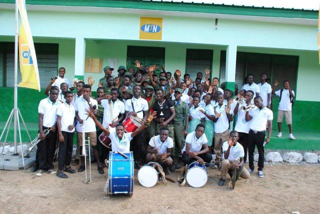 Some students of Akim Asafo SHS in a group picture in front of the new classroom block