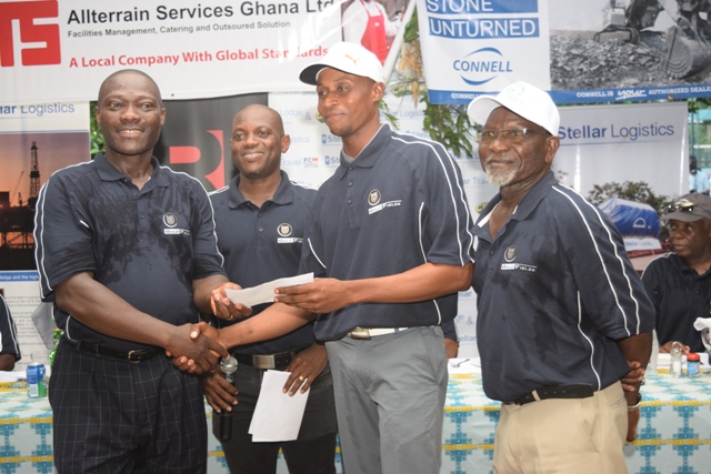 Winner Vincent Torgah (2nd right) receives his cheque from Gold Fields Head Alfred Baku (left) while PGA President, Mr Ayivor (right) and Damang Golf Club Captain Pius Appiah look on