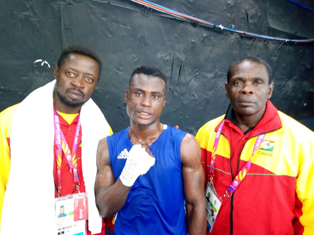 Samuel Yaw Addo (middle) poses with Black Bombers coach, Ofori Asare and assistant, Vincent Akai Nettey after beating Sikiru Ojo to give Ghana a first win in boxing at the 2018 Commonwealth Games in Australia